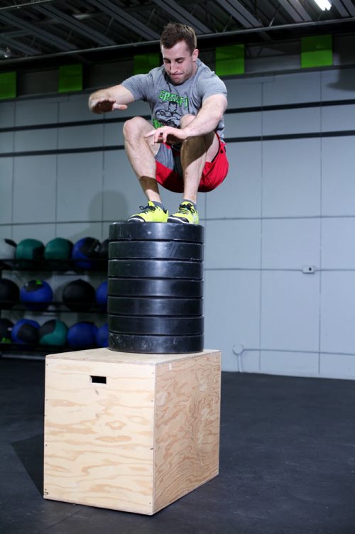 Brandon Sun 17042013 Zach McMillan practices high leaps during training at Crossfit Rocked on 10th Street in Brandon on Tuesday. (Tim Smith/Brandon Sun)