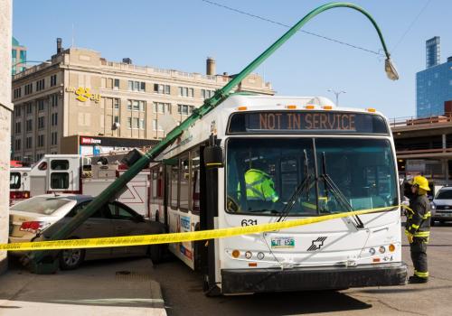 A car and a bus collided around 9:30 a.m. at Memorial Blvd and St. Mary's Ave. The collision knocked over a light pole and traffic light. No injuries were reported. 130419 - Friday, April 19, 2013 - (Melissa Tait / Winnipeg Free Press)