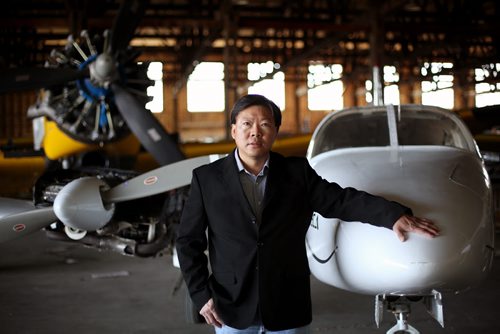 Brandon Sun 19042013 Kevin Choy, President of the Brandon Flying Club, seen in the club's hanger on Friday, has been talking with Air Canada Jazz regarding charter service to Brandon.  (Tim Smith/Brandon Sun)