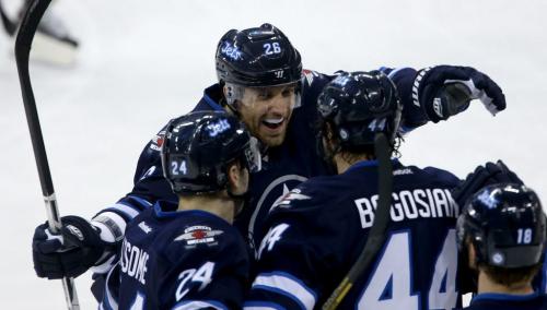 Winnipeg Jets' Blake Wheeler (26) celebrates with Grant Clitsome (24) and Zach Bogosian (44) after he assisted on Bogosian's goal against the New York Islanders' during first period NHL action at MTS Centre in Winnipeg, Saturday, April 20, 2013. (TREVOR HAGAN/WINNIPEG FREE PRESS)