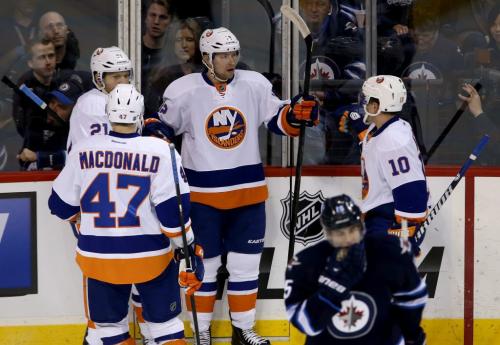 The New York Islanders' celebrate after Josh Bailey (12), middle, scored the Islanders' second goal of the period to retake the lead against the Winnipeg Jets' during first period NHL action at MTS Centre in Winnipeg, Saturday, April 20, 2013. (TREVOR HAGAN/WINNIPEG FREE PRESS)