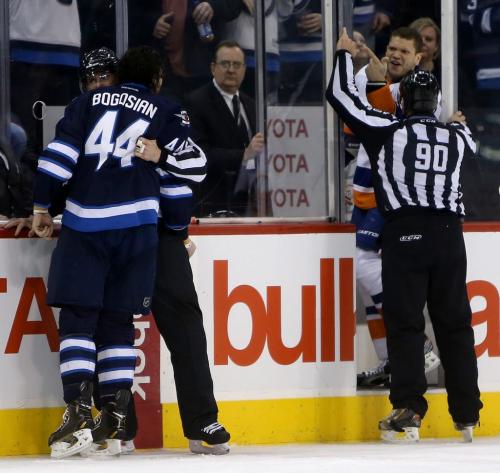 Winnipeg Jets' Zach Bogosian (44) and New York Islanders' Kyle Okposo (21) yell at each other during second period NHL action at MTS Centre in Winnipeg, Saturday, April 20, 2013. (TREVOR HAGAN/WINNIPEG FREE PRESS)