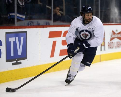 Winnipeg Jets' Zach Bogosian (44) carries the puck behind the net during practice at MTS Centre in front of about 3000 fans from the ticket waiting list who were invited to the special event, Sunday, April 14, 2013. (TREVOR HAGAN/WINNIPEG FREE PRESS)