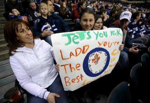 Erin Fanning, Emily Kass, 10, Samantha Chodirker and Josh Kass were among those watching the Winnipeg Jets' practice at MTS Centre. About 3000 fans from the ticket waiting list were invited to the special event, Sunday, April 14, 2013. (TREVOR HAGAN/WINNIPEG FREE PRESS)