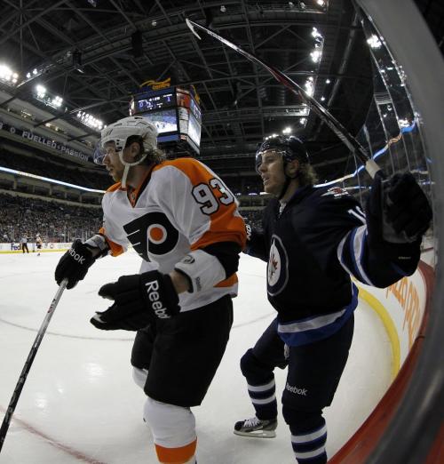 Philadelphia Flyers Jakub Voracek (93) battles with Winnipeg Jets' Bryan Little (18) during the first period of NHL action at MTS Centre in Winnipeg, Saturday, April 6, 2013. (TREVOR HAGAN/WINNIPEG FREE PRESS)