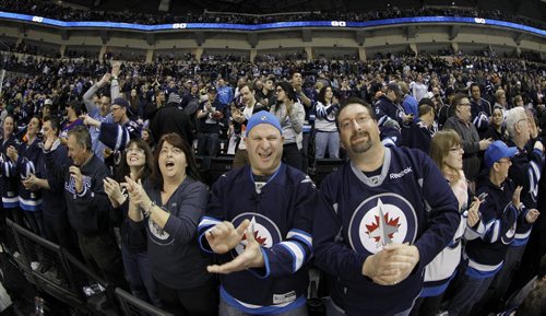 Winnipeg Jets' fans celebrate after a strong second period of NHL hockey action against the Philadelphia Flyers at MTS Centre in Winnipeg, Saturday, April 6, 2013. (TREVOR HAGAN/WINNIPEG FREE PRESS)