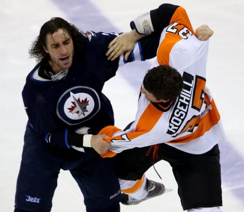 Winnipeg Jets' Chris Thorburn (22) fights Philadelphia Flyers' Jay Rosehill (37) during third period NHL action at MTS Centre in Winnipeg, Saturday, April 6, 2013. (TREVOR HAGAN/WINNIPEG FREE PRESS)