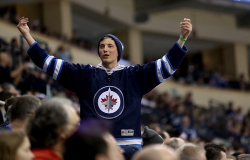 A Winnipeg Jets' fan cheers the team on against the Philadelphia Flyers' during second period NHL action at MTS Centre in Winnipeg, Saturday, April 6, 2013. (TREVOR HAGAN/WINNIPEG FREE PRESS)
