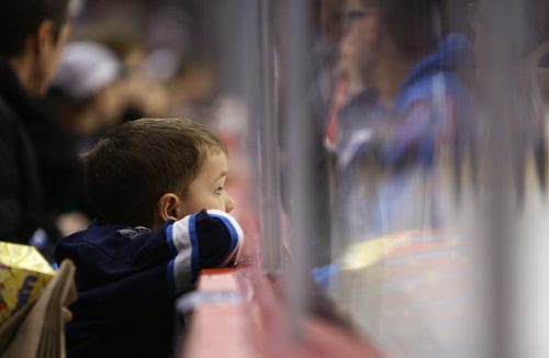 A young Winnipeg Jets' fan looks on as the team plays against the Philadelphia Flyers during second period NHL action at MTS Centre in Winnipeg, Saturday, April 6, 2013. (TREVOR HAGAN/WINNIPEG FREE PRESS) - file for a sad day?
