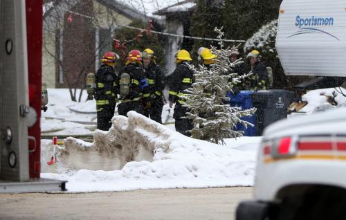 Firefighters on the scene at a fire in Charleswood on Robindale Road. It did not cause any injuries, Sunday, April 7, 2013. (TREVOR HAGAN/WINNIPEG FREE PRESS)