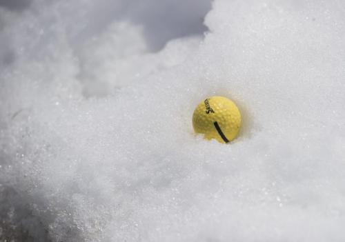 130420 Winnipeg - DAVID LIPNOWSKI / WINNIPEG FREE PRESS  A golf ball in snow at the driving range at Shooters Family Golf Centre Saturday morning. Shooters opening the driving range for the first time this year today.