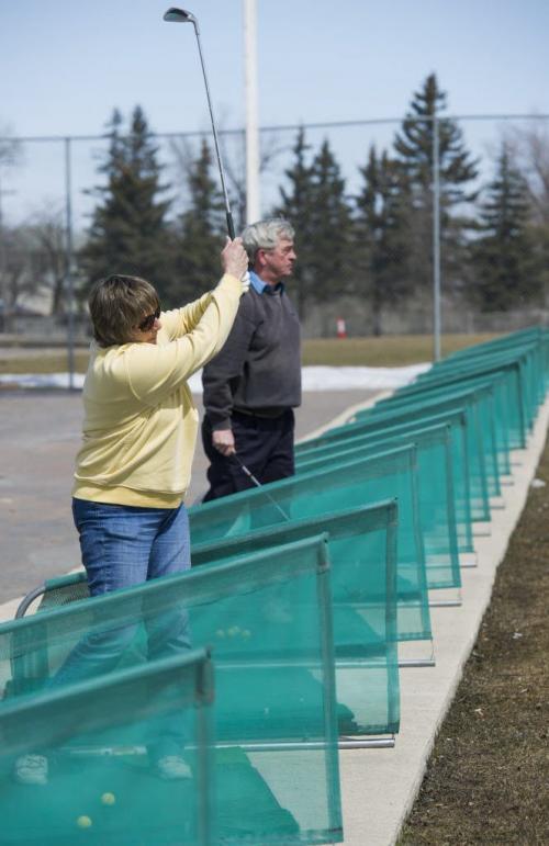 130420 Winnipeg - DAVID LIPNOWSKI / WINNIPEG FREE PRESS  Ethel Urdal and her husband Darcy Urdal hit some balls at the driving range at Shooters Family Golf Centre Saturday morning. Shooters opening the driving range for the first time this year today.