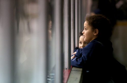 Zara Dequier, 10 and Zayla Dequier, 8, watch the Richmond Sockeyes' face the Saskatoon Royals' in the Keystone Cup gold medal game in St.Malo, Sunday, April 21, 2013. The Keystone Cup is the Western Canada Junior B Hockey Championship. (TREVOR HAGAN/WINNIPEG FREE PRESS)