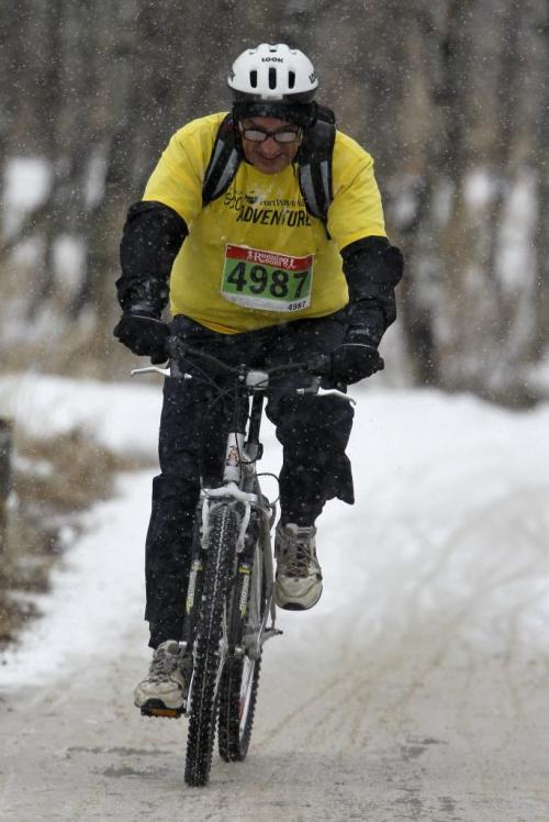 Cyclists dealt with snowy conditions during FortWhyte AliveÄôs EcoAdventure Race. The race is a multi-sport adventure race that includes paddling, running, orienteering and cycling over a 35K course through FortWhyte Alive and Assiniboine Park. Sunday, April 21, 2013. (TREVOR HAGAN/WINNIPEG FREE PRESS)