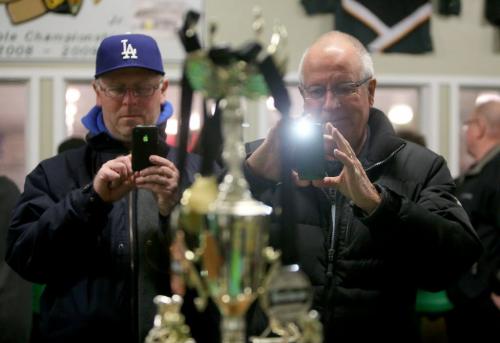Jon Andrews from Richmond BC and Bill McFarlane, from Okotoks, AB, photograph the Keystone Cup Trophy while the Richmond Sockeyes' and Saskatoon Royals' played in the Keystone Cup gold medal game in St.Malo, Sunday, April 21, 2013. The Keystone Cup is the Western Canada Junior B Hockey Championship. (TREVOR HAGAN/WINNIPEG FREE PRESS)