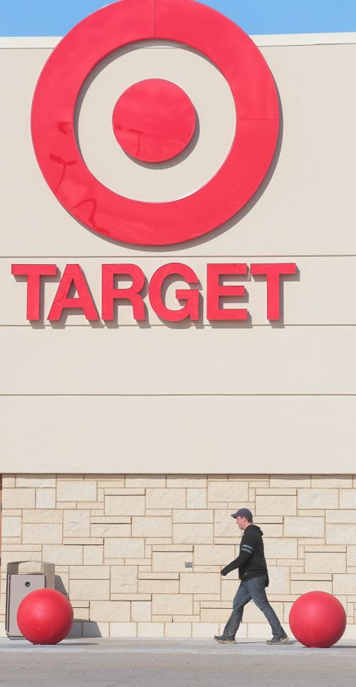 Brandon Sun RIGH ON TARGET -- A pedestrian makes his way along the sidewalk in front of the new Target store location at the Shopper's Mall on Monday morning. Final preparations are being made for the store opening later this month. (Bruce Bumstead/Brandon Sun)