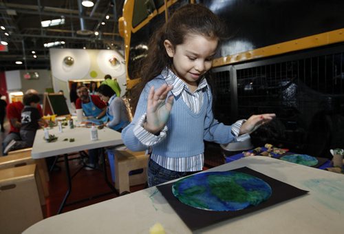 Stdup- The Children's Museum celebrated Earth Day  with activities centred around the theme of reducing ,reusing, and  recycling for kid passing through the facility today .In pic Samara  Sepulveda  age 5  makes a picture of the earth  then learns  about  composting . The kids were also taught how to recycle their snack wrappings and left over snacks . KEN GIGLIOTTI / April . 22 2013 / WINNIPEG FREE PRESS