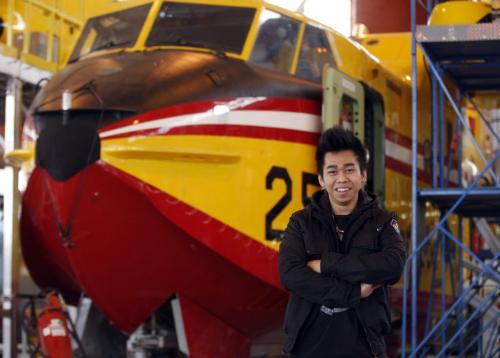 Student  Lawrence Gomez  taking vocational education at Government Air  with water bomber in background . - FYI or Saturday special on vocational education. At each location thereÄôll be a Seven Oaks high school student serving an apprenticeship. Nick Martin Story -  KEN GIGLIOTTI / April . 24 2013 / WINNIPEG FREE PRESS