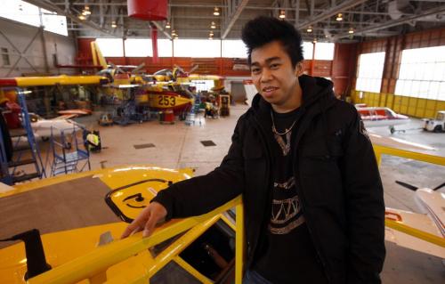 Lawrence Gomez taking vocational education at Government Air hangar with water bomber in background - FYI or Saturday special on vocational education. At each location thereÄôll be a Seven Oaks high school student serving an apprenticeship. Nick Martin Story -  KEN GIGLIOTTI / April . 24 2013 / WINNIPEG FREE PRESS