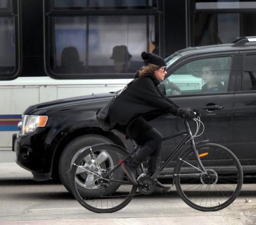 Cyclists make their way through "confusion corner" Wednesday afternoon in rush hour traffic. See story re: Helmet law and yielding to cyclists.....April 24, 2013 - (Phil Hossack / Winnipeg Free Press)