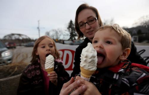 Madelin Lernout, 4 and Flynn Lernout, 2, enjoying some ice cream with their mom, Ashleigh, at the BDI, Friday, April 26, 2013. (TREVOR HAGAN/WINNIPEG FREE PRESS)