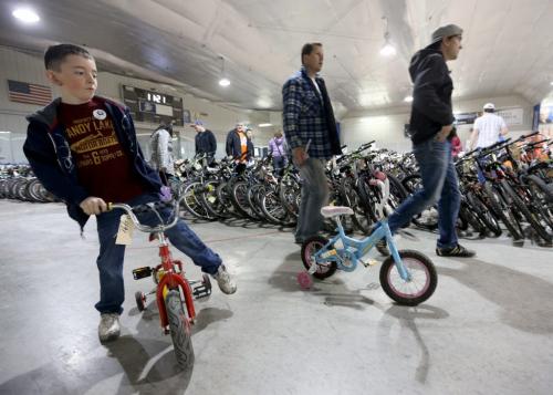 Jack McLean, 6, checking out a new ride at the bike auction at Varsity View Community Centre, Saturday, April 27, 2013. (TREVOR HAGAN/WINNIPEG FREE PRESS)