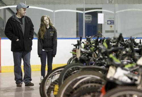 Dion Kellestine and his daughter, Julia, 12, browsing at the bike auction at Varsity View Community Centre, Saturday, April 27, 2013. (TREVOR HAGAN/WINNIPEG FREE PRESS)