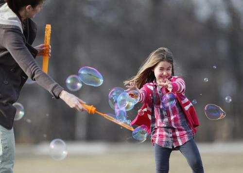 April 27, 2013 - 130427  -  Lindsay Aboud and her niece Isabella play with bubbles at Assiniboine Park Saturday, April 27, 2013. John Woods / Winnipeg Free Press
