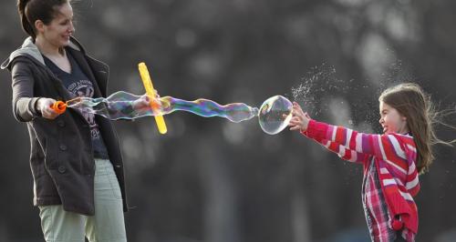 April 27, 2013 - 130427  -  Lindsay Aboud and her niece Isabella play with bubbles at Assiniboine Park Saturday, April 27, 2013. John Woods / Winnipeg Free Press