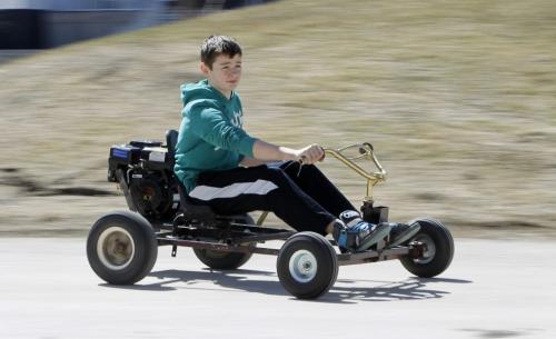 Jackson Pankratz, 12, rides his award winning go-kart Manitoba Science Symposium project at the University of Manitoba, Sunday, April 28, 2013. (TREVOR HAGAN/WINNIPEG FREE PRESS)