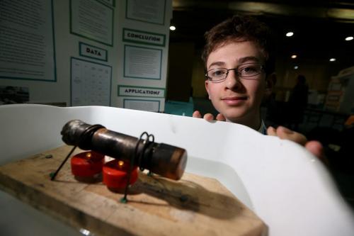Grayson Lewer, 14, a grade 8 student from The Laureate Academy, with his award winning Manitoba Science Symposium project, entitled, Steam Boats, at the University of Manitoba, Sunday, April 28, 2013. (TREVOR HAGAN/WINNIPEG FREE PRESS)