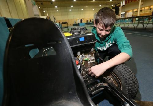 Jackson Pankratz, 12, makes some adjustments to his award winning go-kart Manitoba Science Symposium project at the University of Manitoba, Sunday, April 28, 2013. (TREVOR HAGAN/WINNIPEG FREE PRESS)