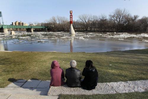 April 28, 2013 - 130428  -  Winnipeggers check out the high water levels at the Forks in Winnipeg Sunday, April 28, 2013. Winnipeg awoke to closed river trails and high water as warmer temperatures raised the Red and Assiniboine rivers. John Woods / Winnipeg Free Press
