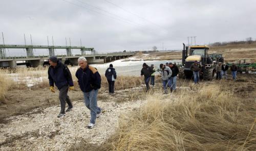 Farmers and supporters hold a rally at the Portage Diversion near Portage la Prairie Monday. They are upset about the out standing compensation still owed to them for their losses in 2012.  Farm machinery was parked in the spillway preventing the province from ¤opening the gates. Kevin Rollason story Wayne Glowacki/ Winnipeg Free Press April 29 2013¤