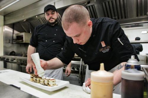 The Lobby on York restaurant at 295 York Ave.  Jesse Friesen, head chef, plates the Pulled Duck Quesadilla while sous chef Ryan Morton watches.  130501 May 01, 2013 Mike Deal / Winnipeg Free Press
