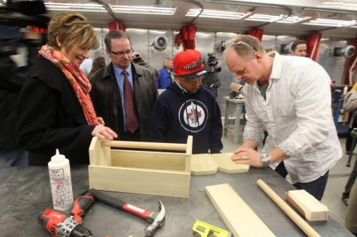 L to R- Nancy Allan Minister of Education, Ronald Hambley- Winnipeg Construction Association RRCC instructor Frank Jess, and Samuel Lopez- Gr. 7 from Elmwood High School at Mobile training labs, Notre Dame campus, Red River College, in a new pilot program exposing grades 7 and 8 students to skilled trades trainingSee Nick Martin Story- May 01, 2013   (JOE BRYKSA / WINNIPEG FREE PRESS)