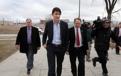 Liberal leader Justin Trudeau makes his way into Sisler High School in Winnipeg Thursday morning with MP Kevin Lamoureux.  Photography Ruth Bonneville Ruth Bonneville /  Winnipeg Free Press)