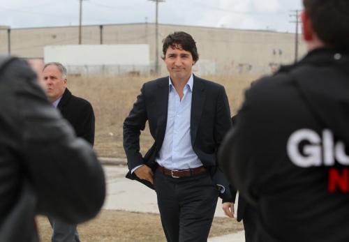 Liberal leader Justin Trudeau makes his way into Sisler High School in Winnipeg Thursday morning with MP Kevin Lamoureux.  Photography Ruth Bonneville Ruth Bonneville /  Winnipeg Free Press)