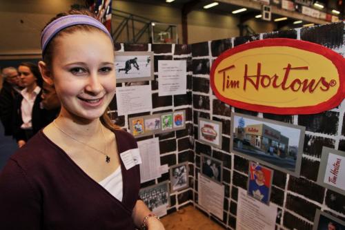 Heather Milan a grade nine student from Mennonite Brethren Collegiate Institute at her display on the life of Tim Horton and the restaurant that bears his name. Heather is taking part in the Red River Heritage Fair at the University of Winnipeg on Thursday.  130502 May 02, 2013 Mike Deal / Winnipeg Free Press