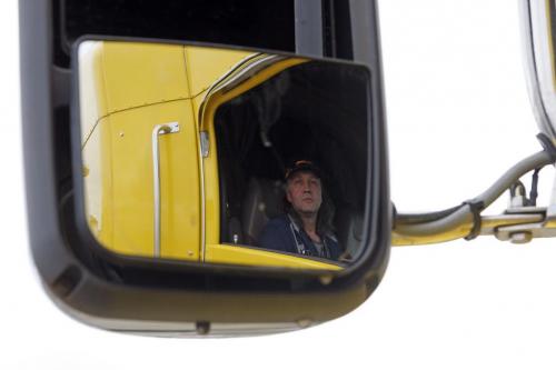 Thomas Penner sen through his driverside side veiw mirror. Long haul transport Trappers  Transit truck driver Thomas Tenner makes his weekly  run  to the US to deliver  french fries down   Hwy 75 through Emerson  - Randy Turner story - KEN GIGLIOTTI / May 2  2013 / WINNIPEG FREE PRESS