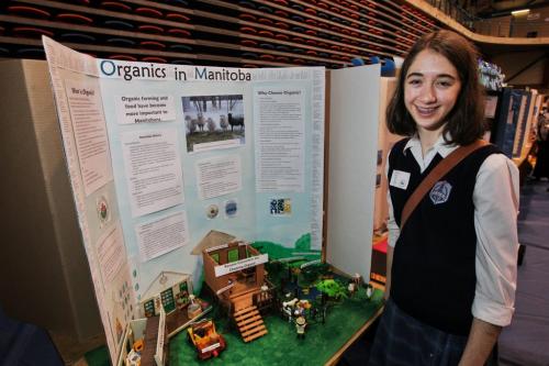 Emma Reznichek a grade nine student at St. Mary's Academy at her display about Organics in Manitoba during the Red River Heritage Fair at the University of Winnipeg on Thursday.  130502 May 02, 2013 Mike Deal / Winnipeg Free Press
