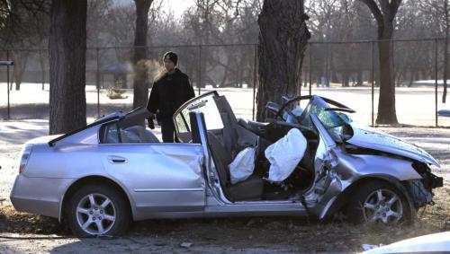 Winnipeg Police at the crash scene Friday morning on north Main St. after a  vehicle crossed the sidewalk, went through the chain link fence of the Kildonan Park Golf Course  and hit a  tree. It is unknown the extent of injuries.  Wayne Glowacki / Winnipeg Free Press May 3 2013