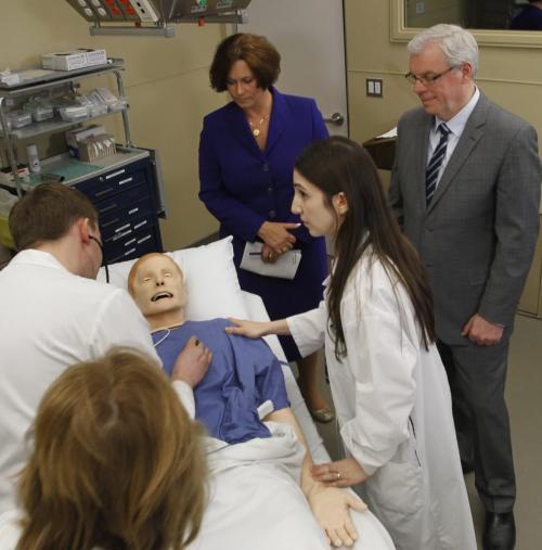 Premier Greg Selinger and Health Minister Theresa Oswald with "Moose" the SimMan 3G patient simulator in the  U of M Clinical Learning and Simulation Facility in the  Brodie Centre Friday for their announcement regarding physician training and recruitment.  At left,  Dr. Kristjan Thompson, Emergency Medicine Resident and Robin Ducas Cardiology Resident give a demonstration with "Moose" who simulating a cardiac arrest.   See Larry Kusch story(WAYNE GLOWACKI/WINNIPEG FREE PRESS) Winnipeg Free Press May 3 2013