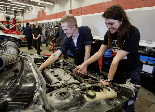 LtoR Ritchie Gordon  and  Katryna Rome  work on engine in Auto Tec course - Vocational training shops at  Kildonan East Collegiate Äì nick martin story continuing story  trades training and apprenticeships  in high schools- KEN GIGLIOTTI / May 3  2013 / WINNIPEG FREE PRESS