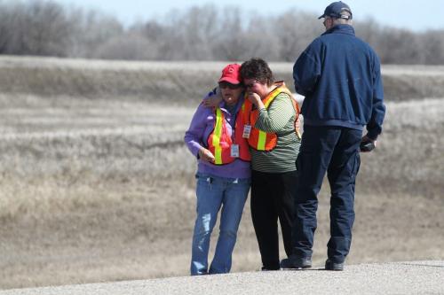Frances Johnson (red hat)  and her sister Pauline Blair react with tears of joy after hearing from an RCMP Officer that their grand nephew, 3 year old Nathaniel Daily was found next to number one highway 3 miles from his home, 12 hours after he went missing from his home in a small town of Sidney.  Photography Ruth Bonneville Ruth Bonneville /  Winnipeg Free Press)