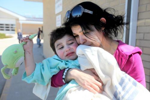 Savannah Malyon embraces her 3 year old son Nathaniel as they walk out of the Portage Hospital Saturday afternoon after Nathaniel's escape from his home in Sidney Manitoba Friday night.  Nathaniel Dailey  snuck out of his home around 10:30pm Friday night and was found playing in a ditch near number one highway Saturday morning. He was transferred with his mom from Portage hospital to the Children's Hospital in Wpg. Saturday afternoon  for further assessment.   See story for details.  Photography Ruth Bonneville Ruth Bonneville /  Winnipeg Free Press)