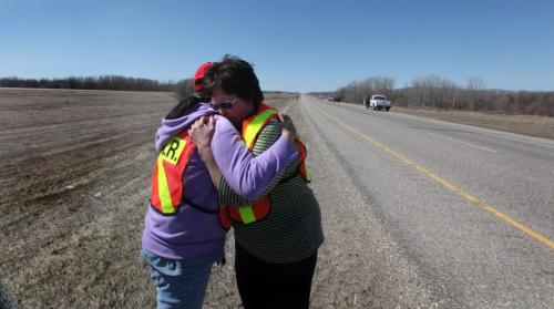 Frances Johnson (red hat)  and her sister Pauline Blair react with tears of joy after hearing from an RCMP Officer that their grand nephew, 3 year old Nathaniel Daily was found next to number one highway 3 miles from his home, 12 hours after he went missing from his home in a small town of Sidney.  One of the sister's had been up all night looking for him. See Story.  Photography Ruth Bonneville Ruth Bonneville /  Winnipeg Free Press)
