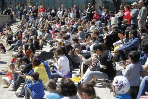 A large crowd watches Steve Diamond perform with his border collies soon after getting his busking pass at The Forks, Saturday, May 4, 2013. (TREVOR HAGAN/WINNIPEG FREE PRESS)