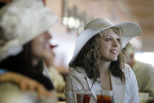 Krista Hodgins from Portage la Prairie watches the 139th Kentucky Derby with Sherry Cote, Ryan Cote and Blair Cote at Assiniboia Downs, Saturday, May 4, 2013. (TREVOR HAGAN/WINNIPEG FREE PRESS)