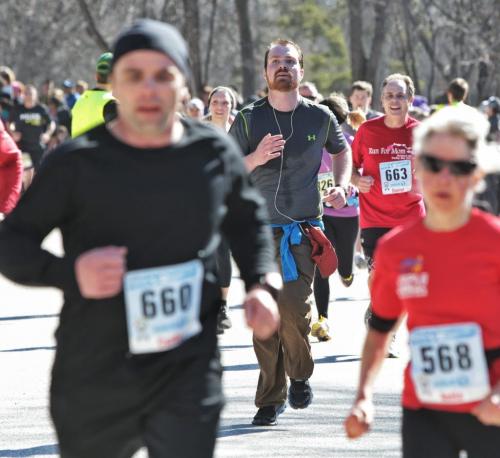 Participants approach the finish line during the Winnipeg Police Service half marathon at Assiniboine Park Sunday.  130505 May 05, 2013 Mike Deal / Winnipeg Free Press